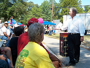 Magician Chaz Misenheimer entertains a festival audience