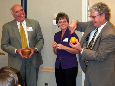 Magician Chaz demonstrates a point at a business seminar