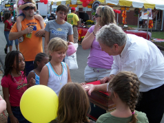 Magician Chaz Misenheimer does close-up magic at festival